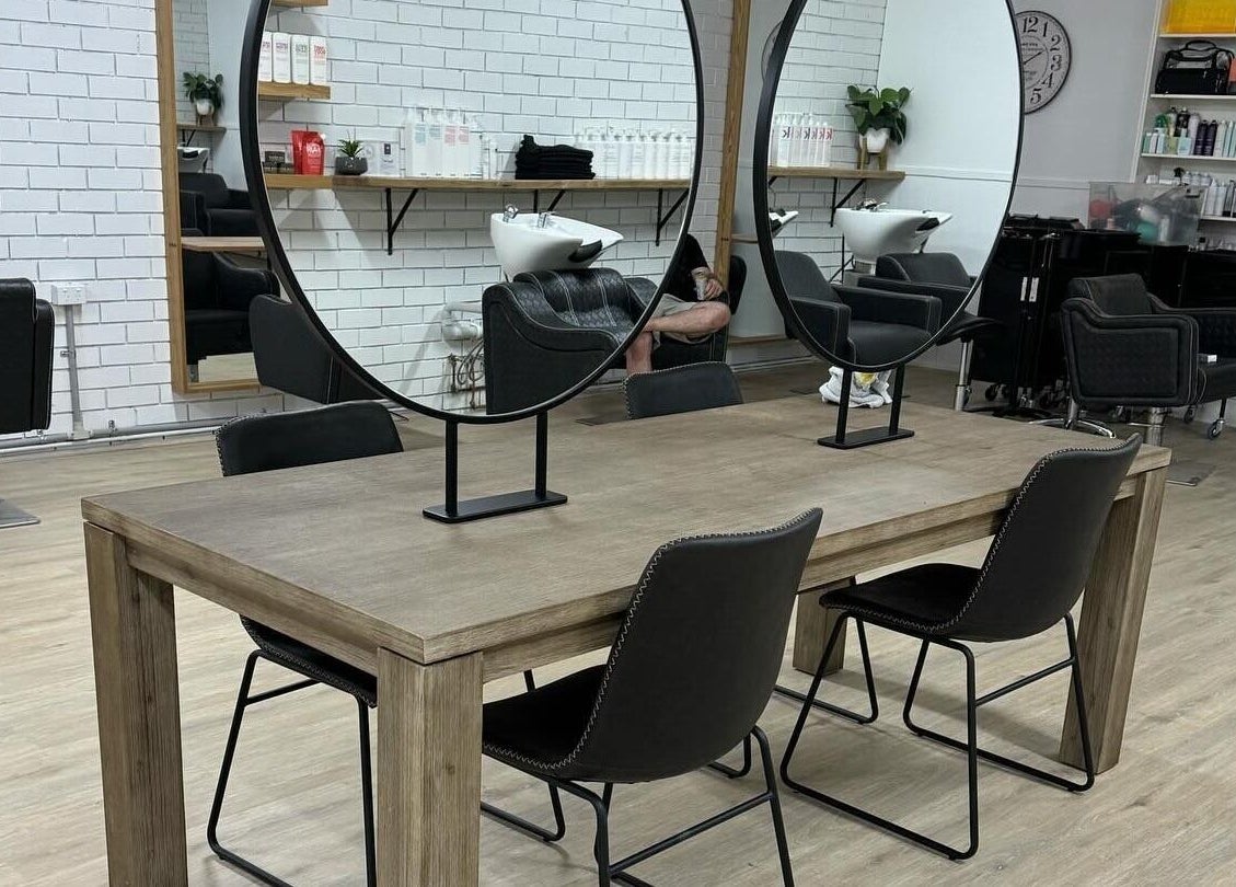 Modern styling stations at Spencer the Salon, Alexandra, Victoria, AU, with sleek chairs and mirrors.