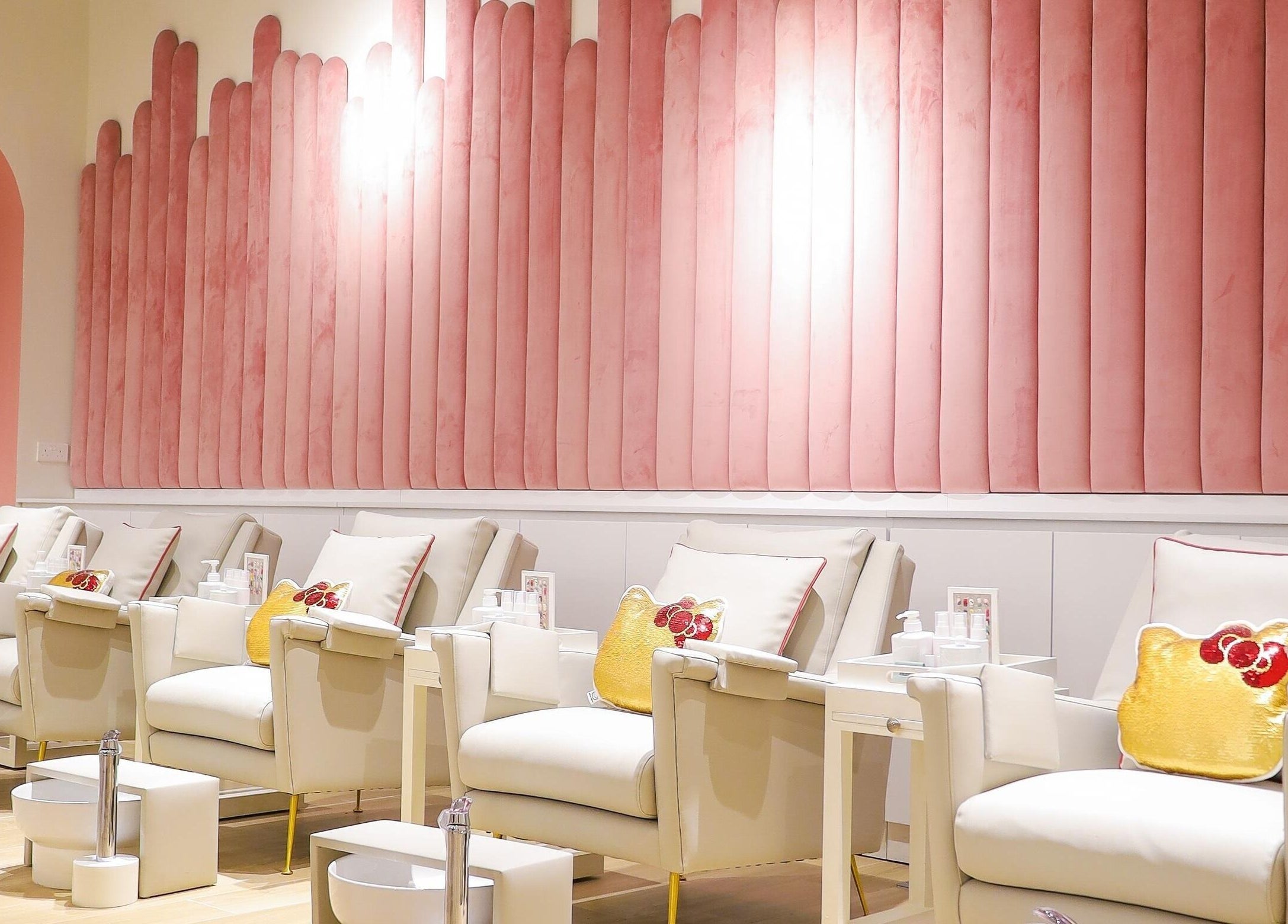 Elegant manicure chairs at Hello Kitty Beauty Spa Dubai, Dubai, Dubai, AE, with pink decor and Hello Kitty accents.