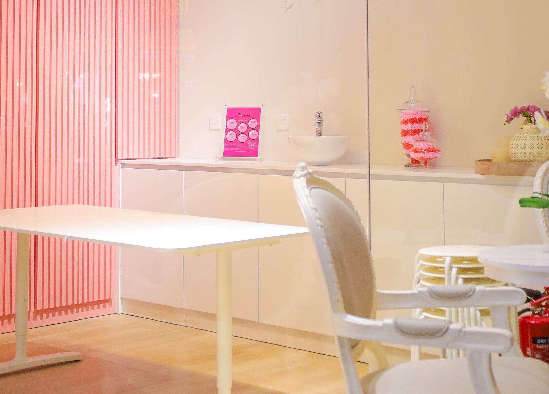 Chic pink and white interior at Hello Kitty Beauty Spa Dubai, Dubai, Dubai, AE. Elegant seating and decor.