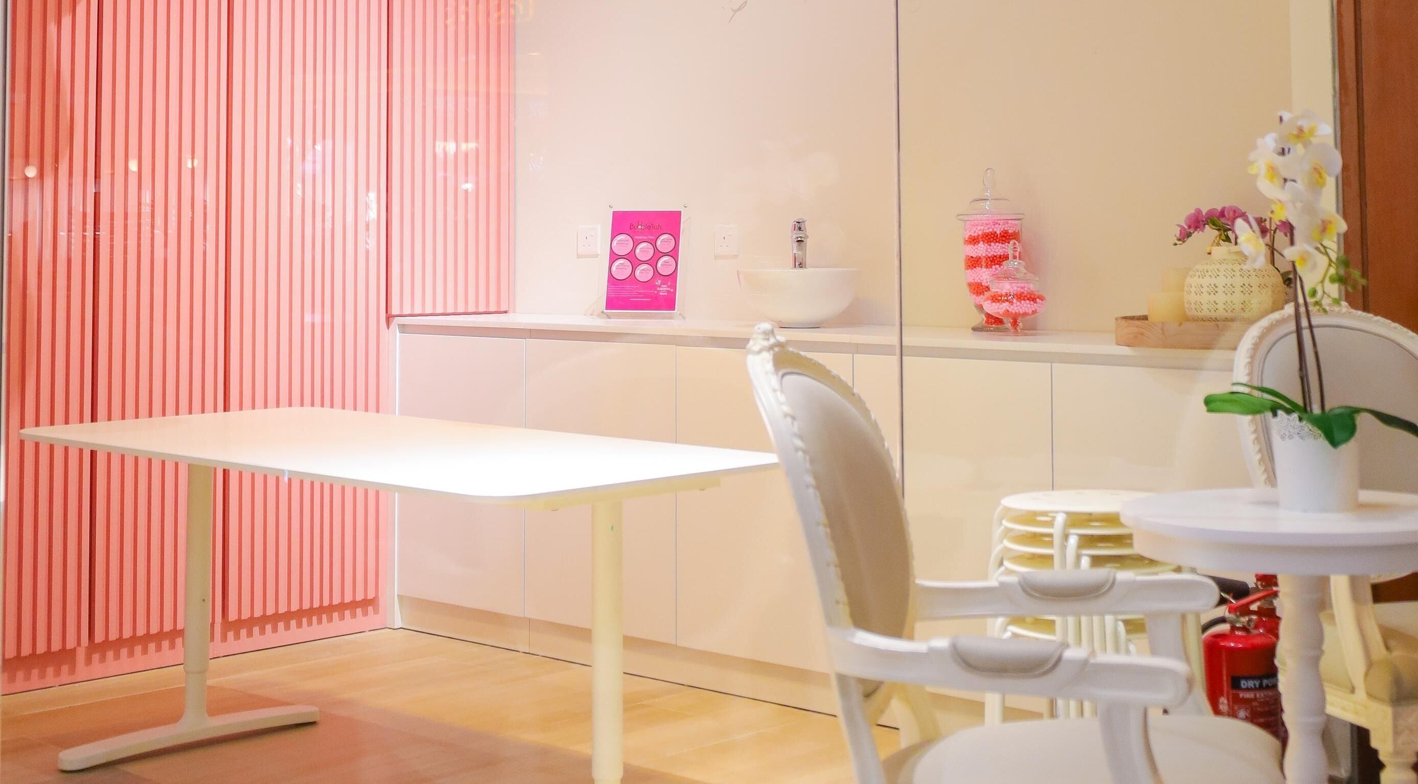 Chic pink and white interior at Hello Kitty Beauty Spa Dubai, Dubai, Dubai, AE. Elegant seating and decor.