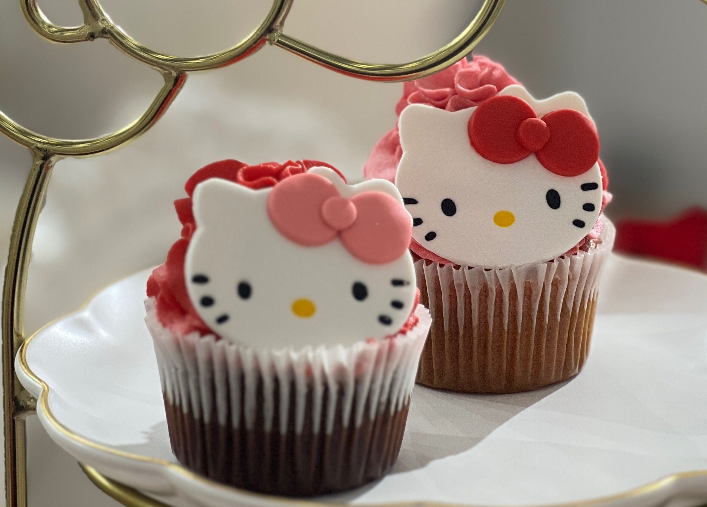 Hello Kitty-themed cupcakes at Hello Kitty Beauty Spa Dubai, Dubai, Dubai, AE on a decorative tray.