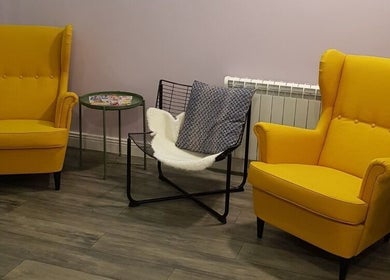 Bright yellow chairs adorn the welcoming lounge at Vogue Hairdressing Salon, Athy, County Kildare, IE.