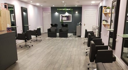 Modern interior of Vogue Hairdressing Salon in Athy, County Kildare, IE, featuring stylish styling chairs and mirrors.