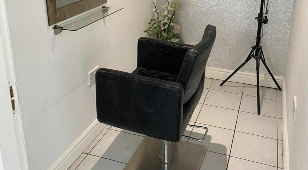 Sophisticated styling chair in The Hair Company, Codsall, England, GB, offering a serene beauty experience.