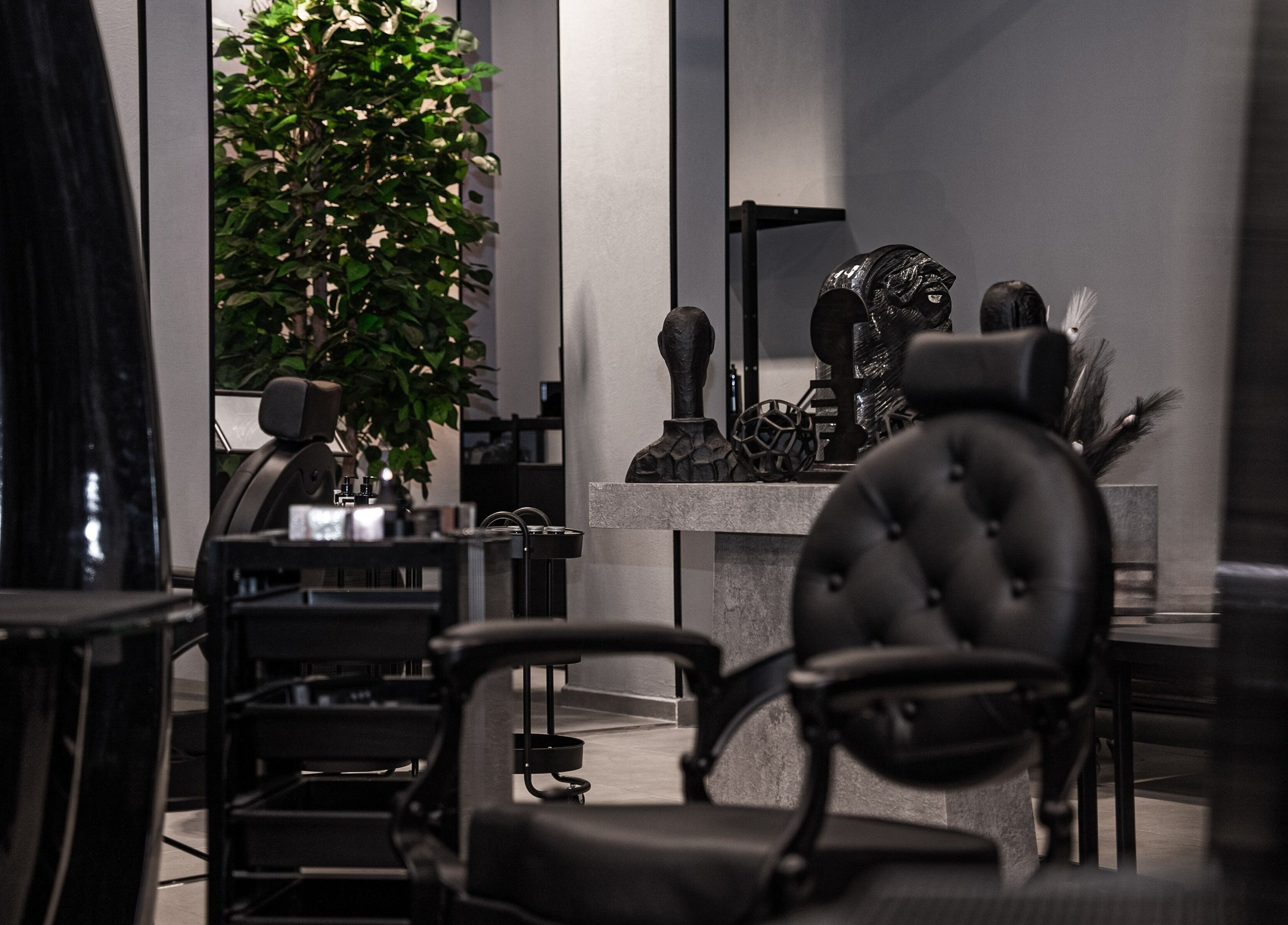 Modern interior of Toni Vayz | Men | Elite Lounge Shorofat Park, featuring sleek chairs and decor in Shorofat Park, SA.