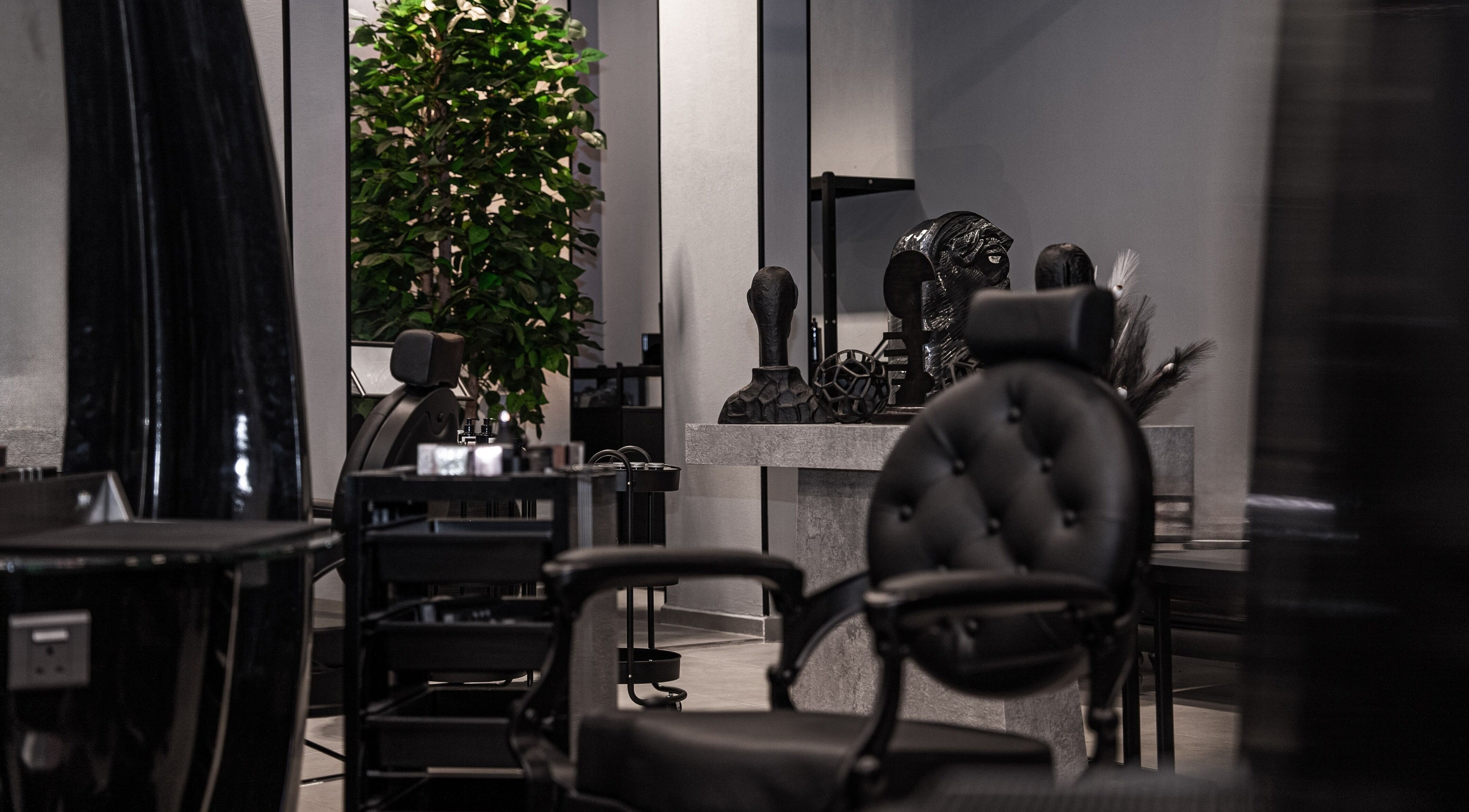 Modern interior of Toni Vayz | Men | Elite Lounge Shorofat Park, featuring sleek chairs and decor in Shorofat Park, SA.