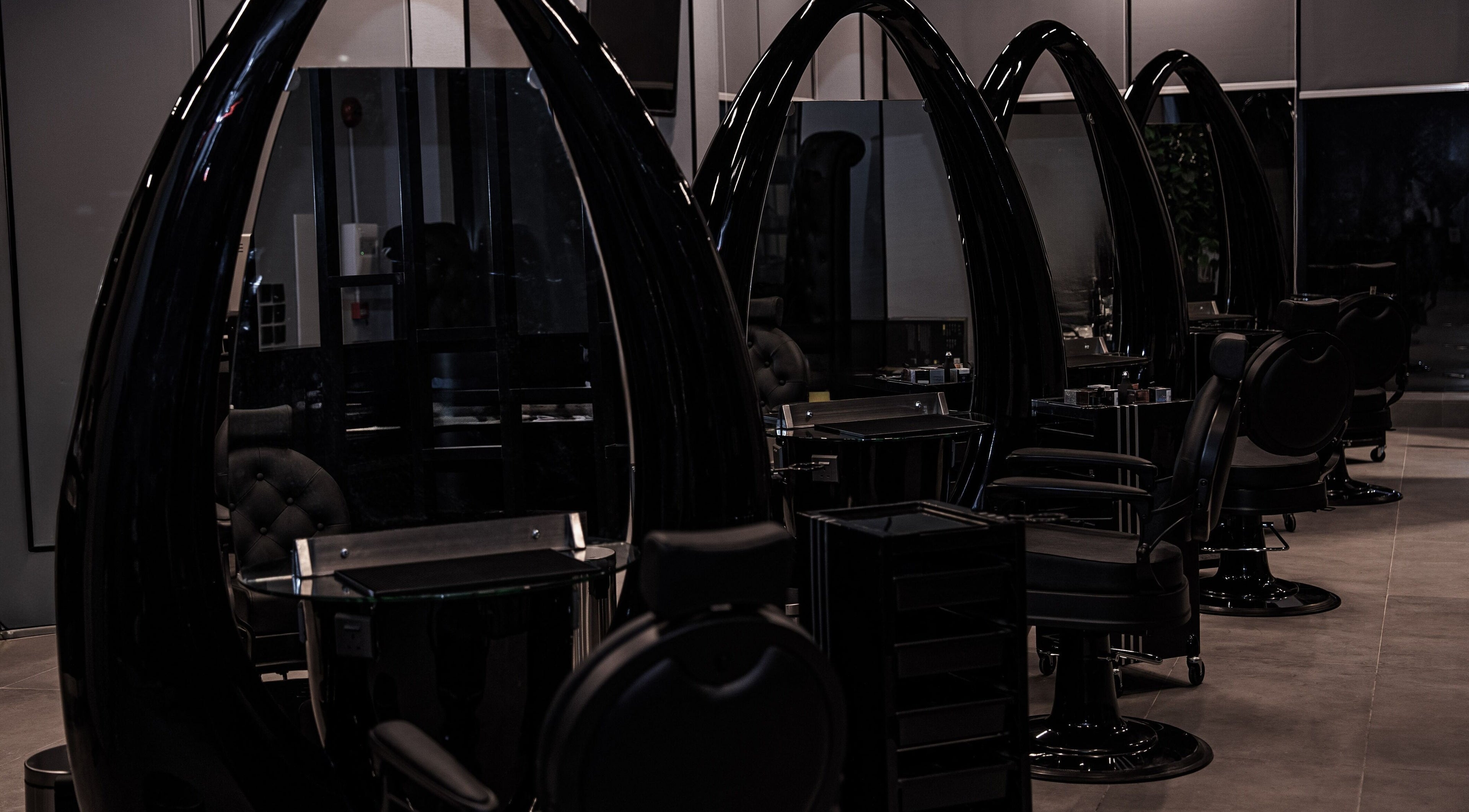 Elegant styling chairs at Toni Vayz | Men | Elite Lounge Shorofat Park, Shorofat Park, SA, showcasing modern design.