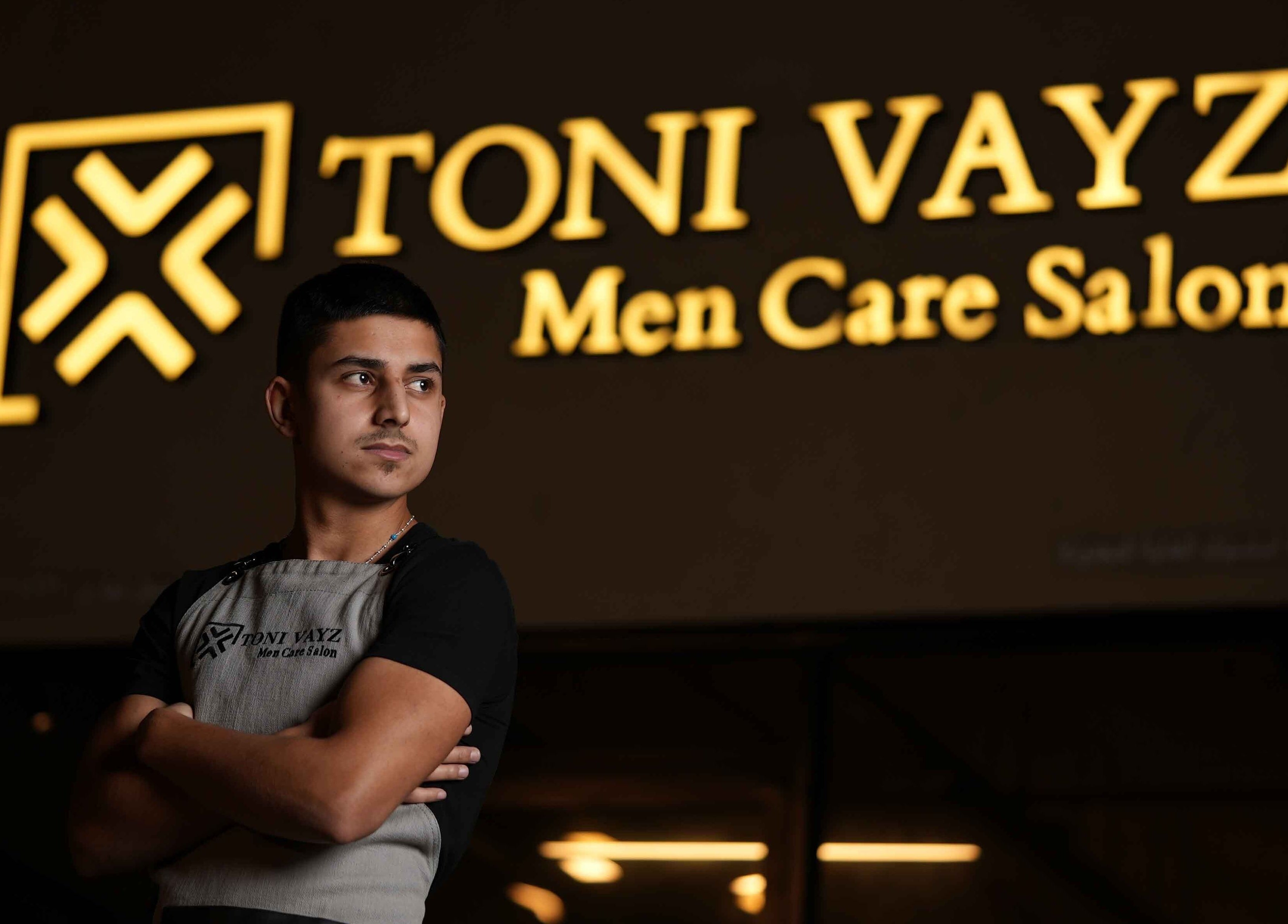 Staff member at Toni Vayz Men Alkhobar Alshubaily, located at Ansab Plaza, SA, welcoming clients.