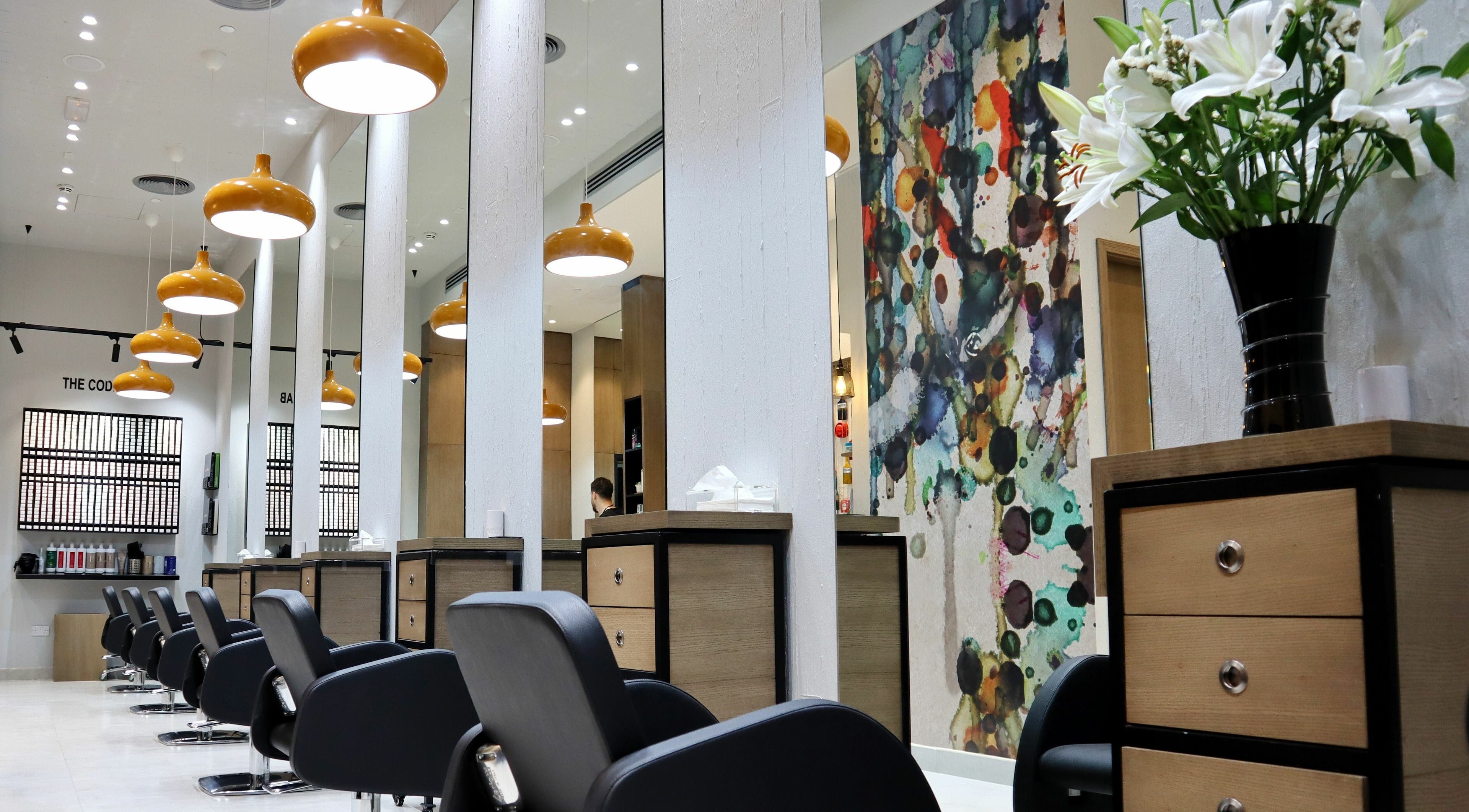 Interior of Code Hair Ladies Salon - Al sofouh 1- Dubai Media city, Dubai, AE, featuring stylish decor and seating.