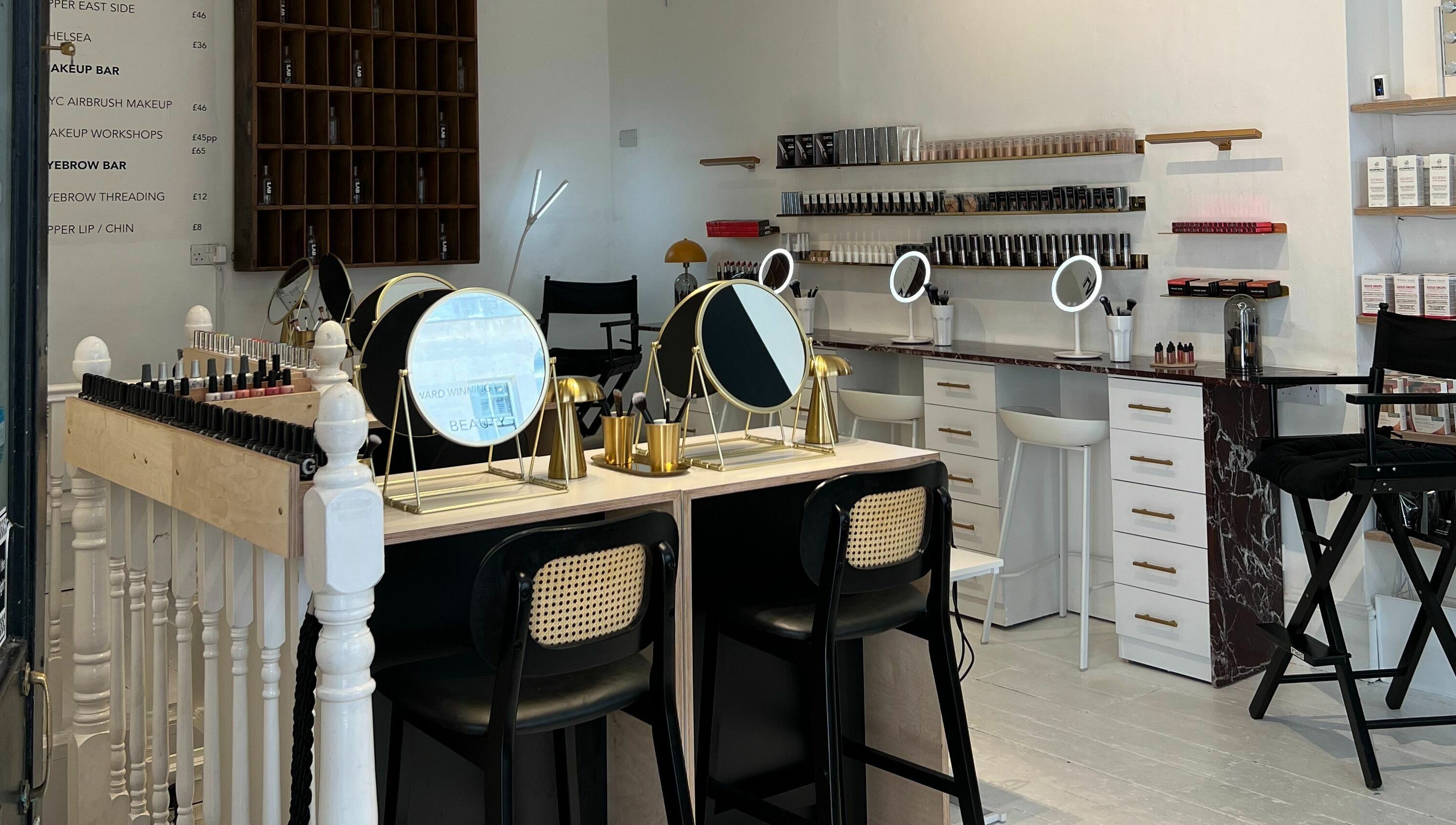 Modern beauty studio at LittleLAB, Bath, England, GB featuring chic vanity setups and product displays.