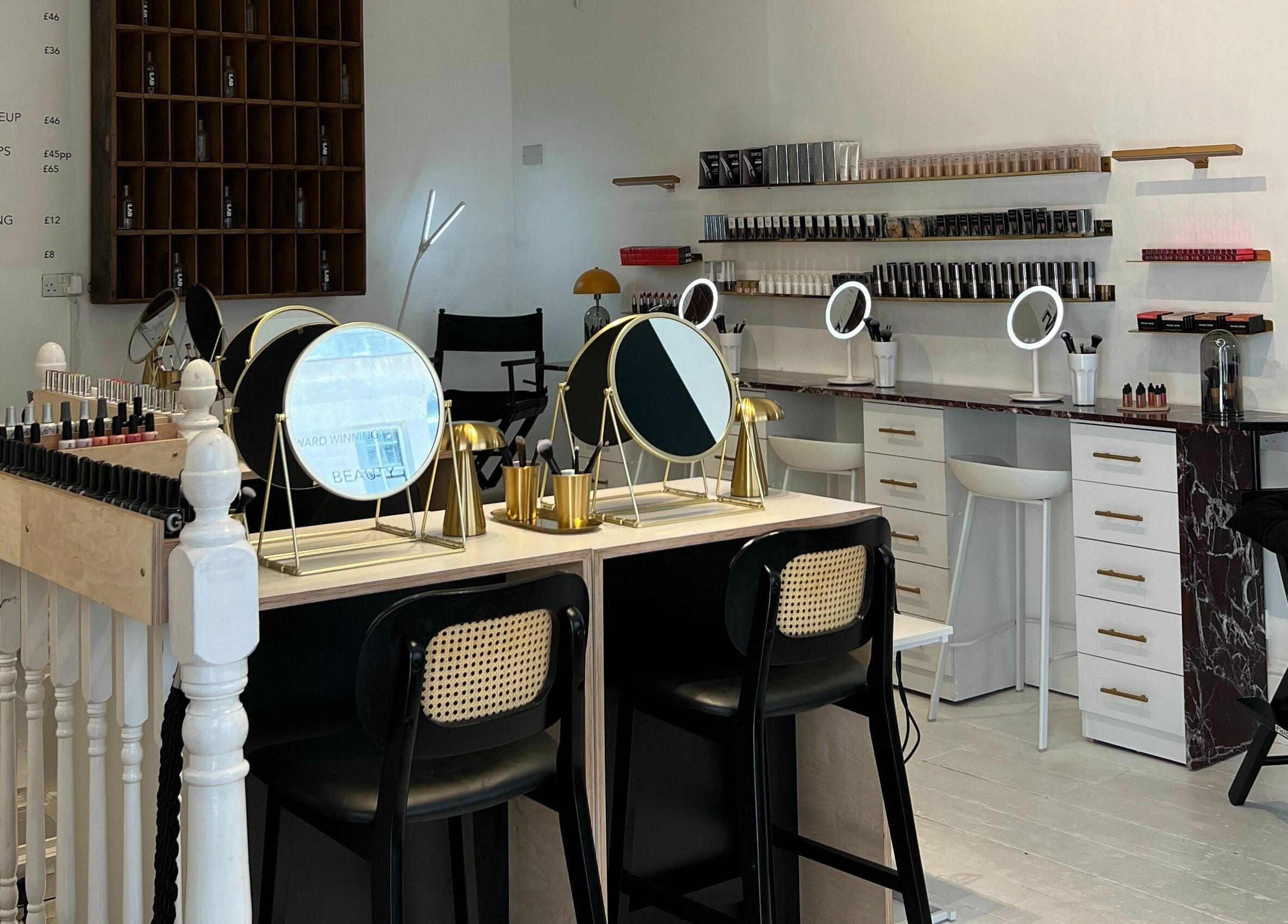 Modern beauty studio at LittleLAB, Bath, England, GB featuring chic vanity setups and product displays.