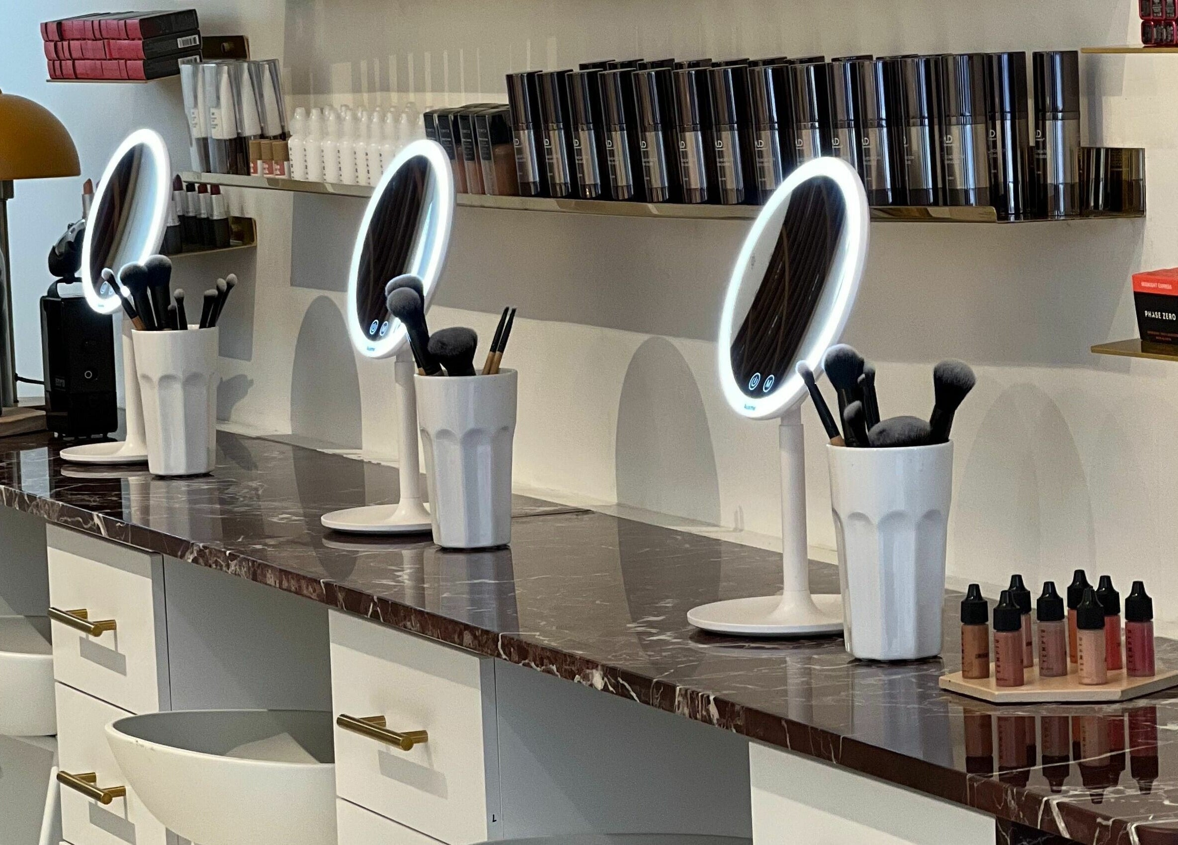 Modern beauty station at LittleLAB, Bath, England, GB with mirrors and makeup tools.
