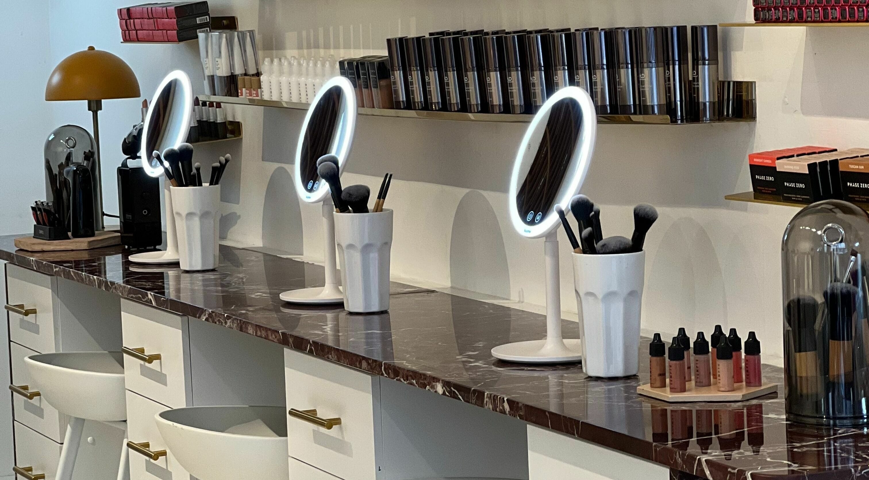 Modern beauty station at LittleLAB, Bath, England, GB with mirrors and makeup tools.