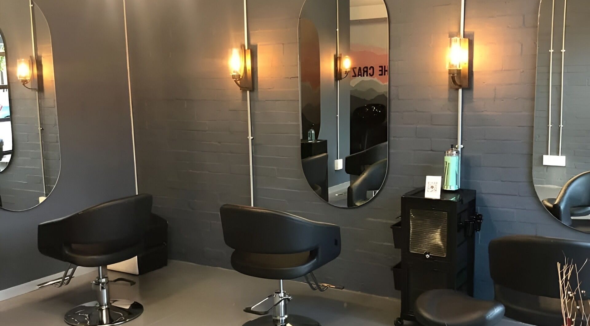 Modern salon chairs and mirrors at Ezzie Hair and Make Up Studio in Cape Town, Western Cape, ZA.