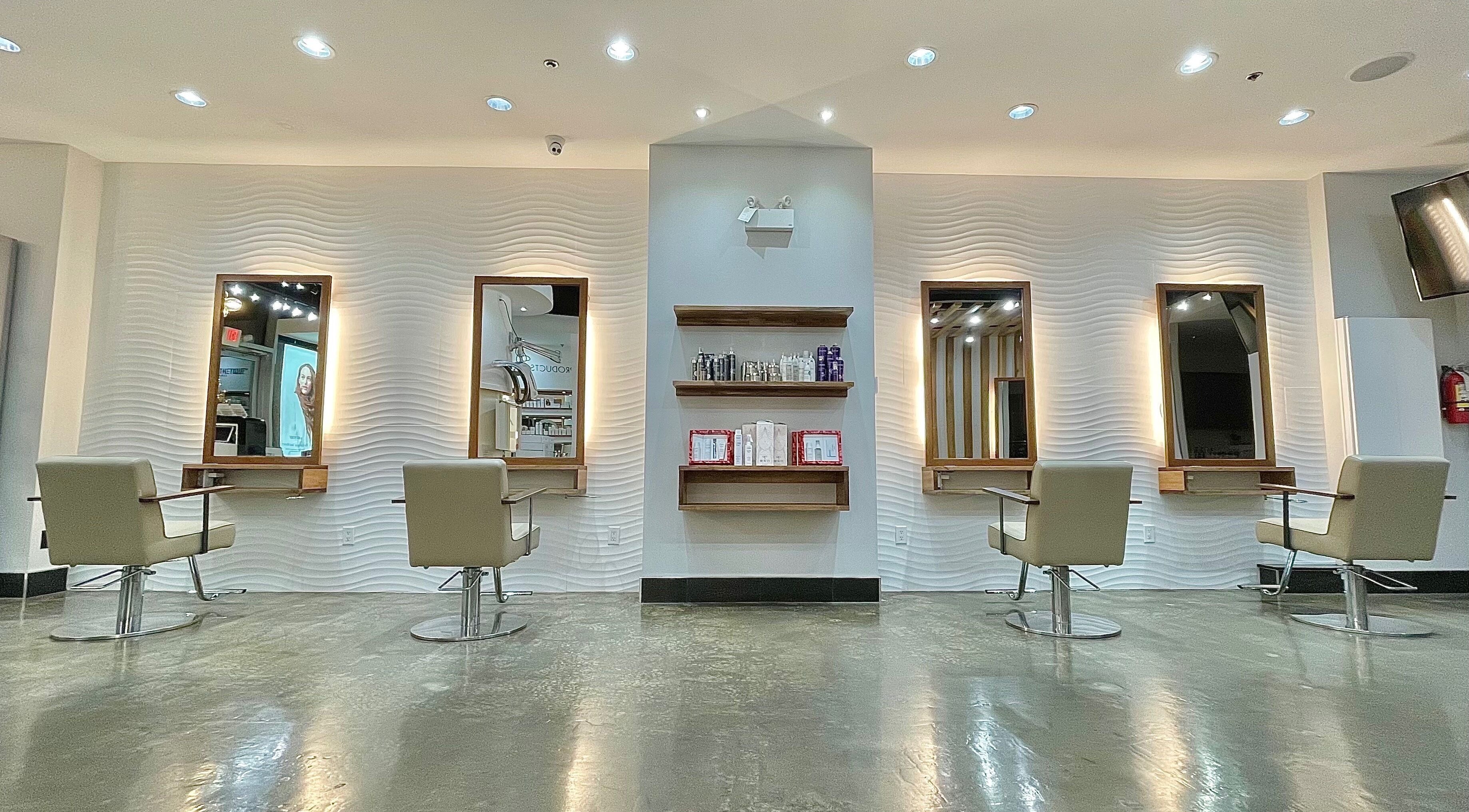 Modern salon interior at NUVIDA HAIR Yaletown, Vancouver, British Columbia, CA, showcasing styling stations.