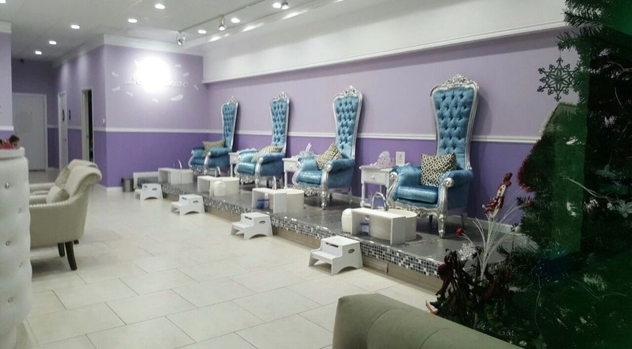 Elegant pedicure chairs at Le Muse Beauty in San Gabriel, California, US, showcasing plush blue seating.