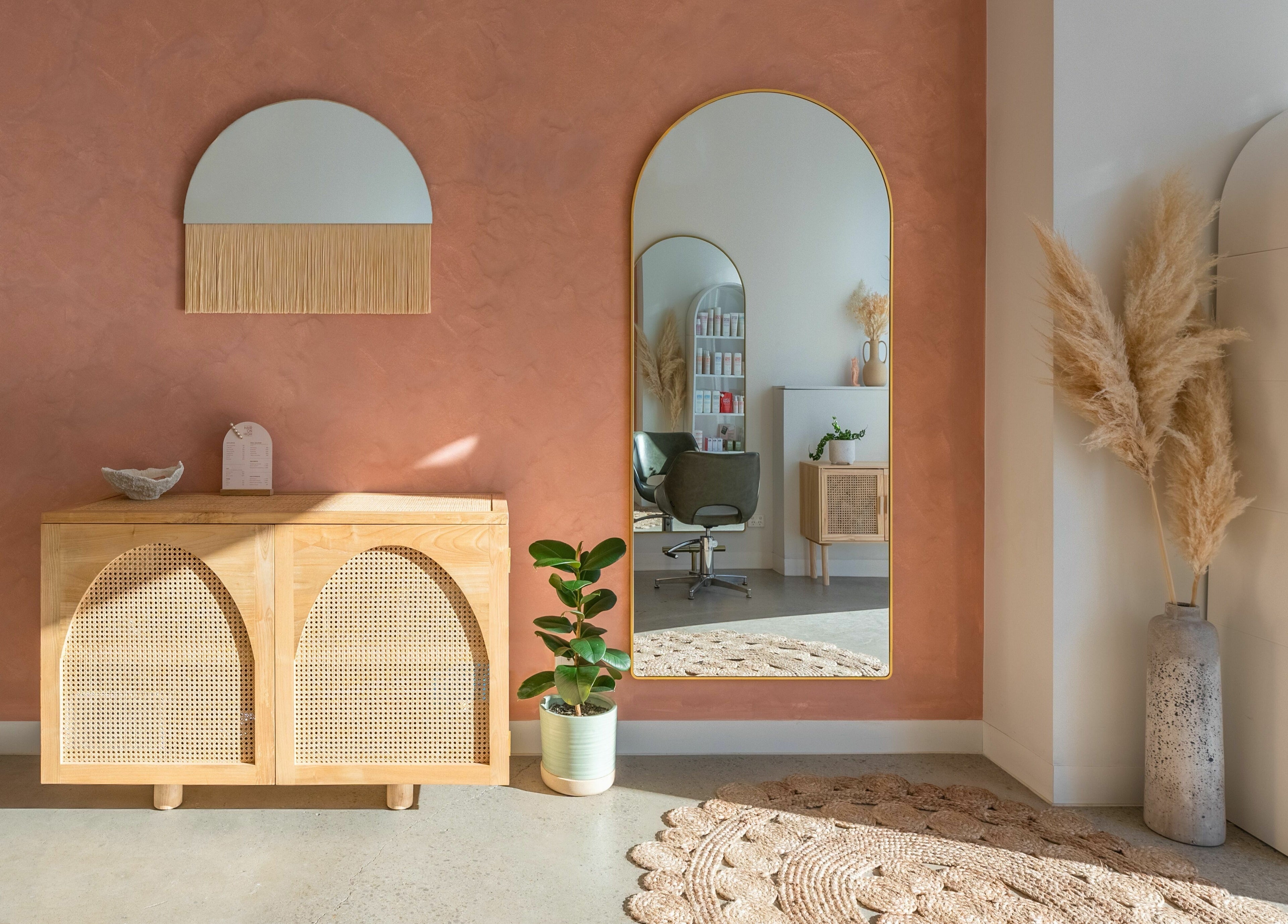 Elegant salon interior at HAIR ON HIGH, Melbourne, Victoria, AU featuring warm tones and modern decor.