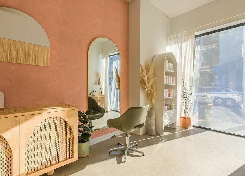 Elegant salon interior with mirror and stylist chair at HAIR ON HIGH, Melbourne, Victoria, AU.