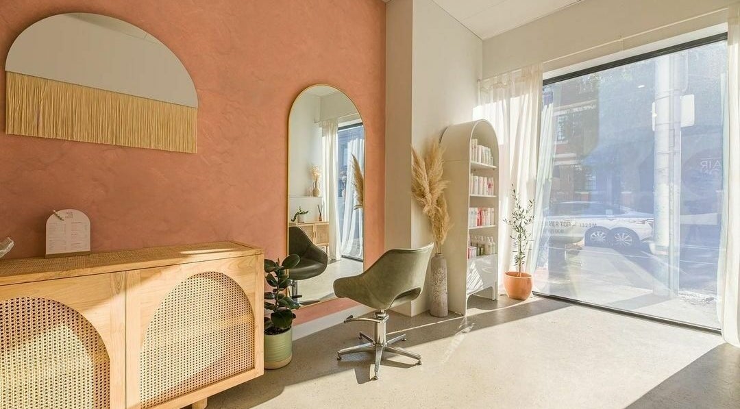 Elegant salon interior with mirror and stylist chair at HAIR ON HIGH, Melbourne, Victoria, AU.