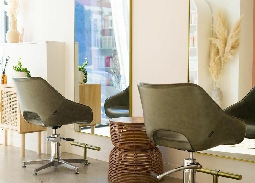 Modern salon interior at HAIR ON HIGH in Melbourne, Victoria, AU featuring stylish decor and elegant seating.