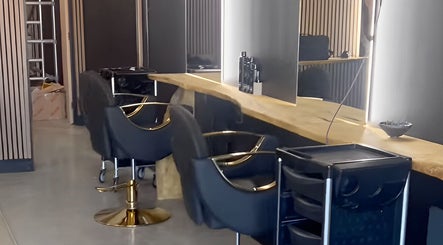 Stylish salon chairs and mirrors at Mimosa Hair, Twigworth, England, GB create a luxurious ambiance.