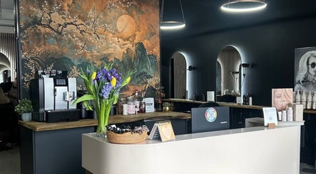 Elegant interior of Mimosa Hair in Twigworth, England, GB featuring a floral mural and stylish decor.