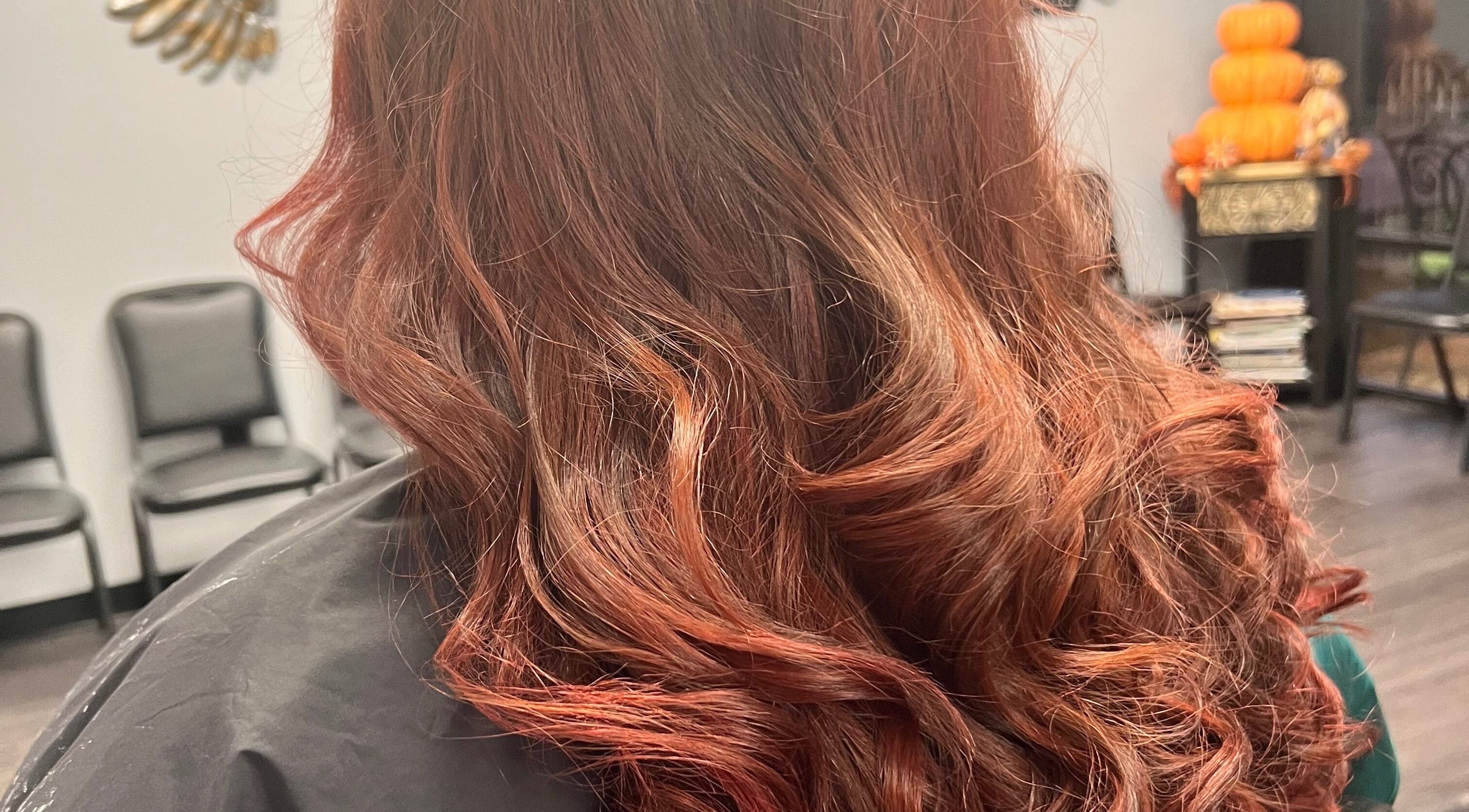Lustrous red curls styled at Sonja @ Rockn Hair Styling Studio, Pineville, Louisiana, US.