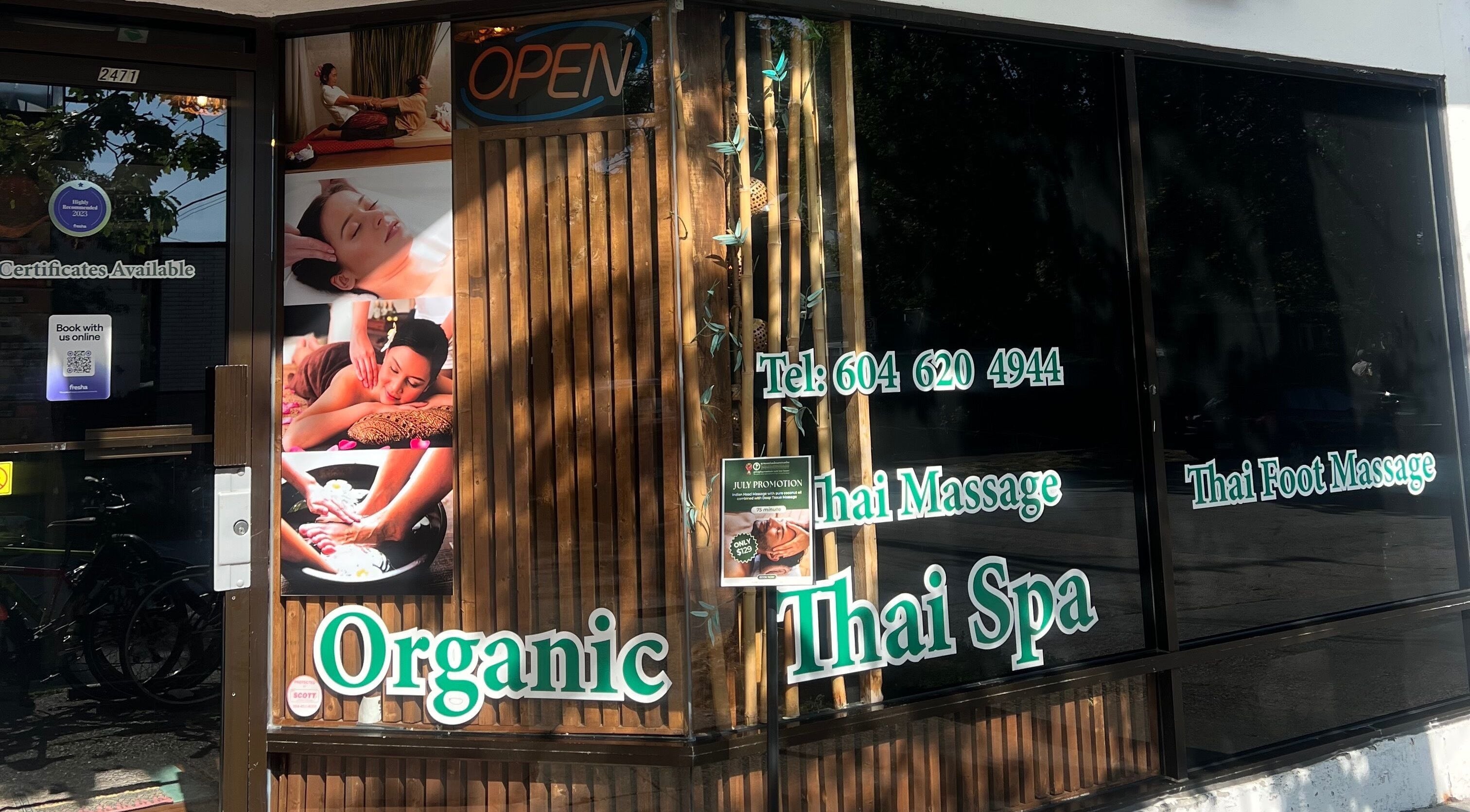Front view of Organic Thai Spa in Vancouver, British Columbia, CA with relaxing images and service signage.
