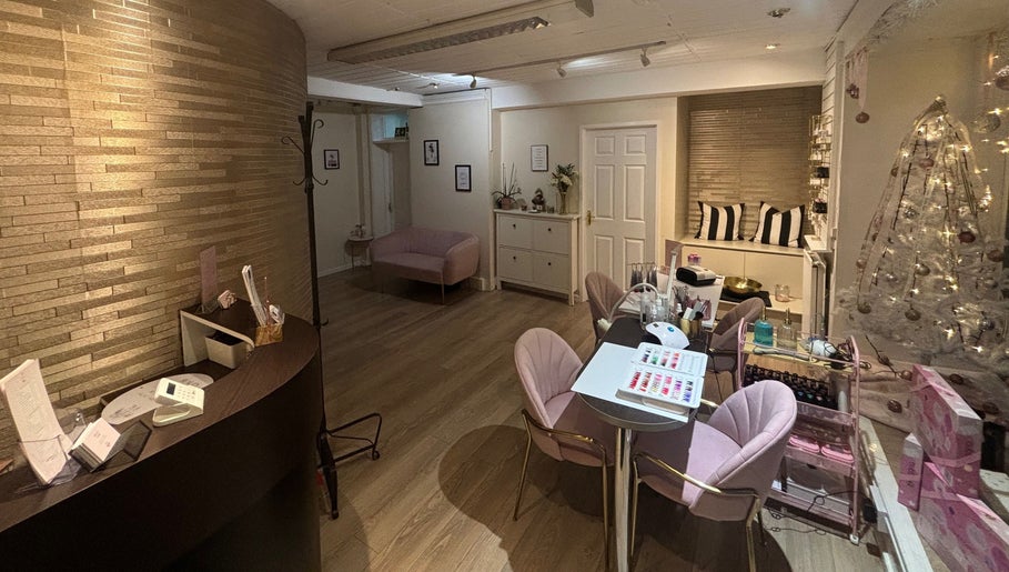 Beauty Within reception area in Cheadle, England, GB: stylish decor with cozy seating and elegant lighting.