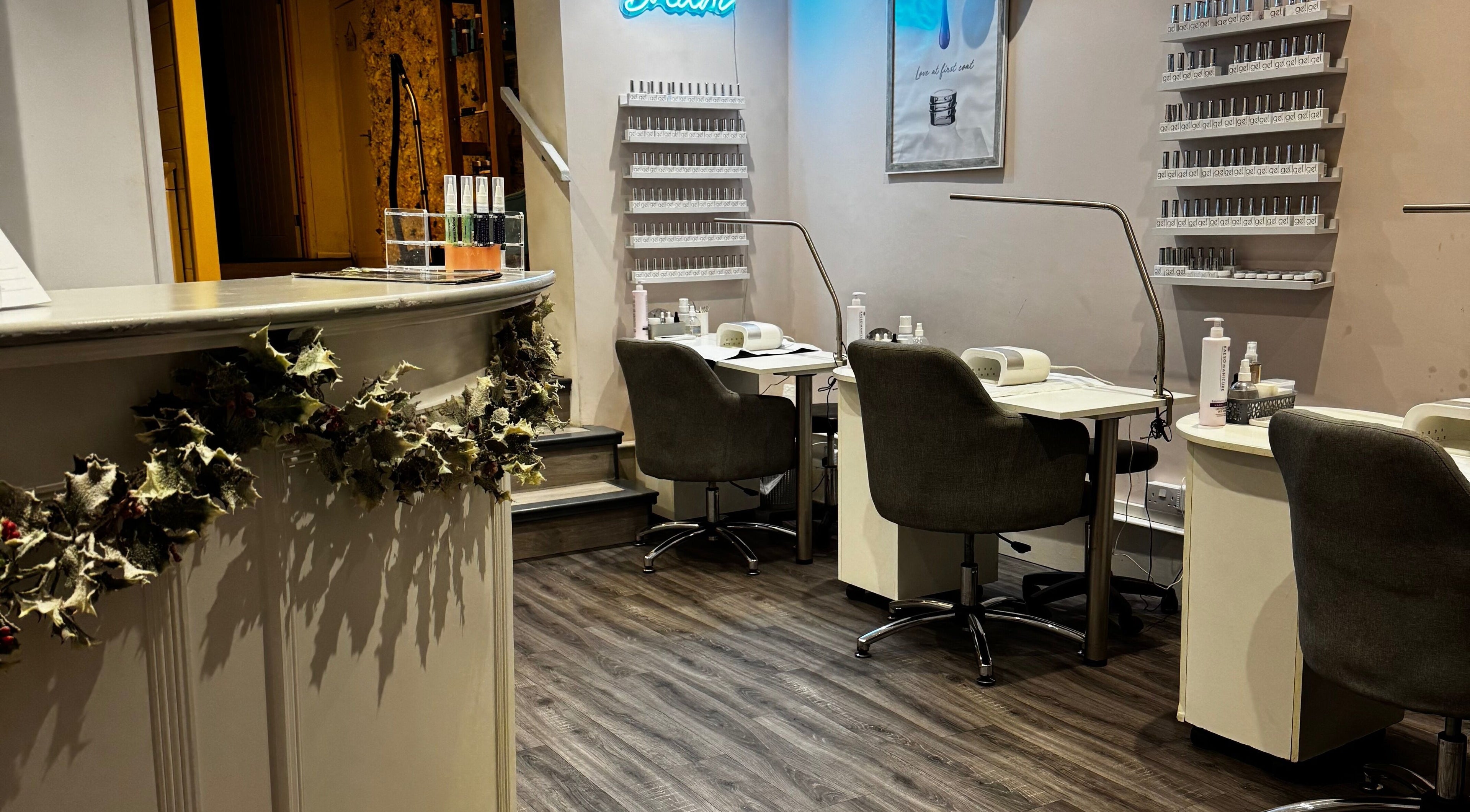 Modern nail station at The Beauty Shack, Dunstable, England. Cozy decor and sleek chairs for a relaxing experience.