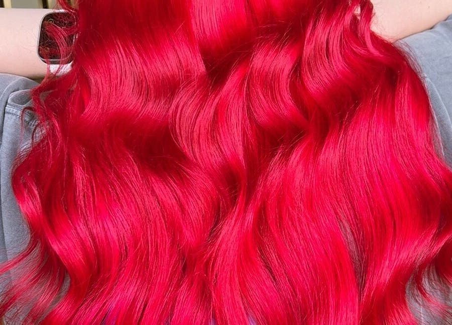 Vibrant red hair styled in waves at Bella Beautiful, Mawson Lakes, South Australia, AU.