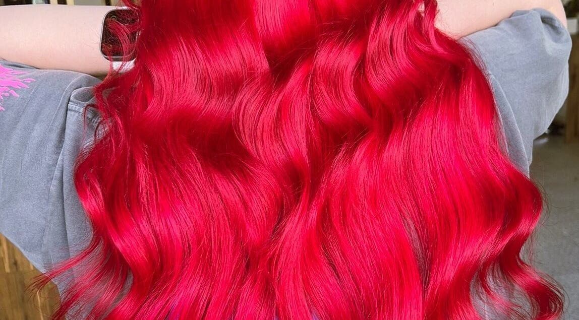 Vibrant red hair styled in waves at Bella Beautiful, Mawson Lakes, South Australia, AU.