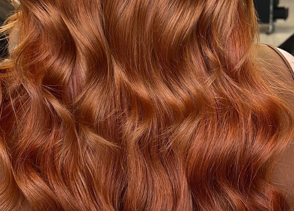 Lustrous red hair waves at Bella Beautiful, Mawson Lakes, South Australia, AU showcase stunning salon styling.