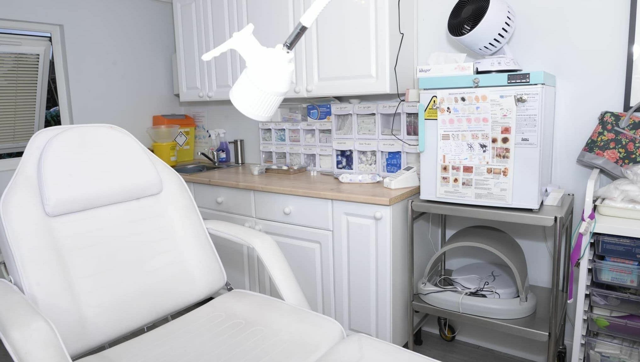 A modern and clean treatment room at Tocolo Ltd, Abbots Langley, England, GB, featuring a comfortable white chair.