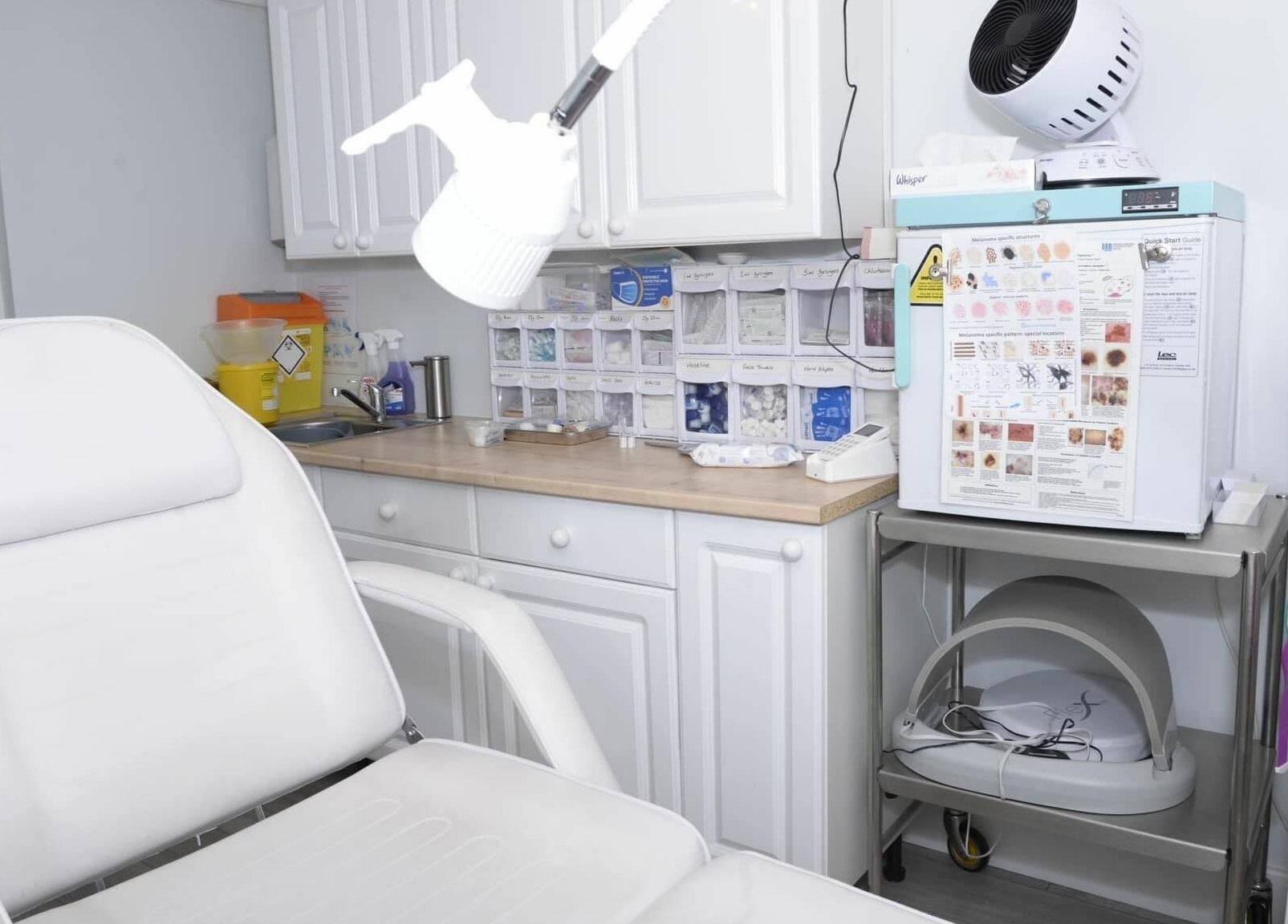 A modern and clean treatment room at Tocolo Ltd, Abbots Langley, England, GB, featuring a comfortable white chair.