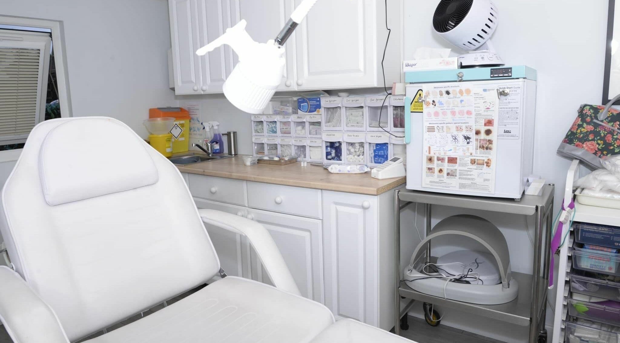 A modern and clean treatment room at Tocolo Ltd, Abbots Langley, England, GB, featuring a comfortable white chair.