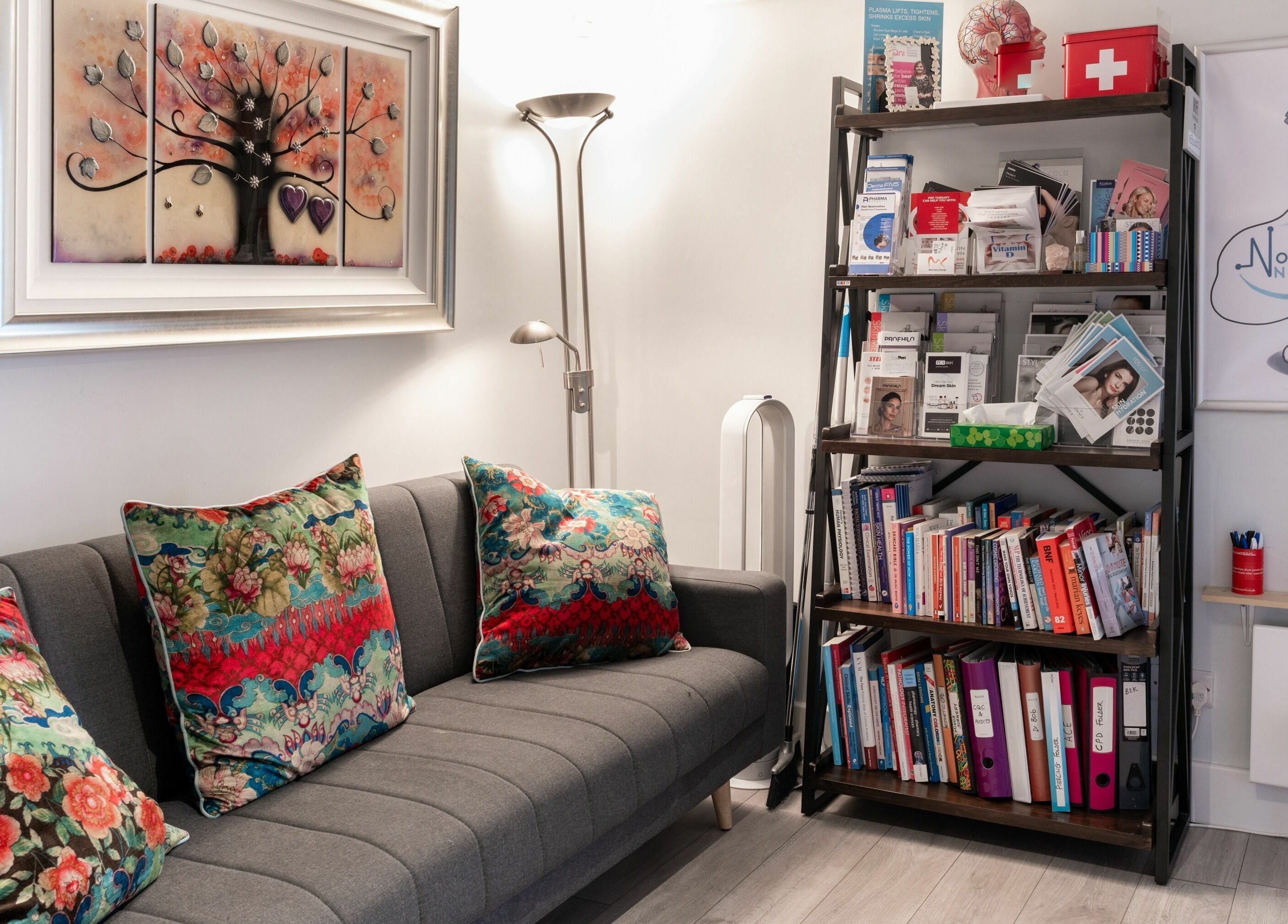 Welcoming lounge area at Tocolo Ltd, Abbots Langley, England, GB, featuring a sofa and bookshelf.