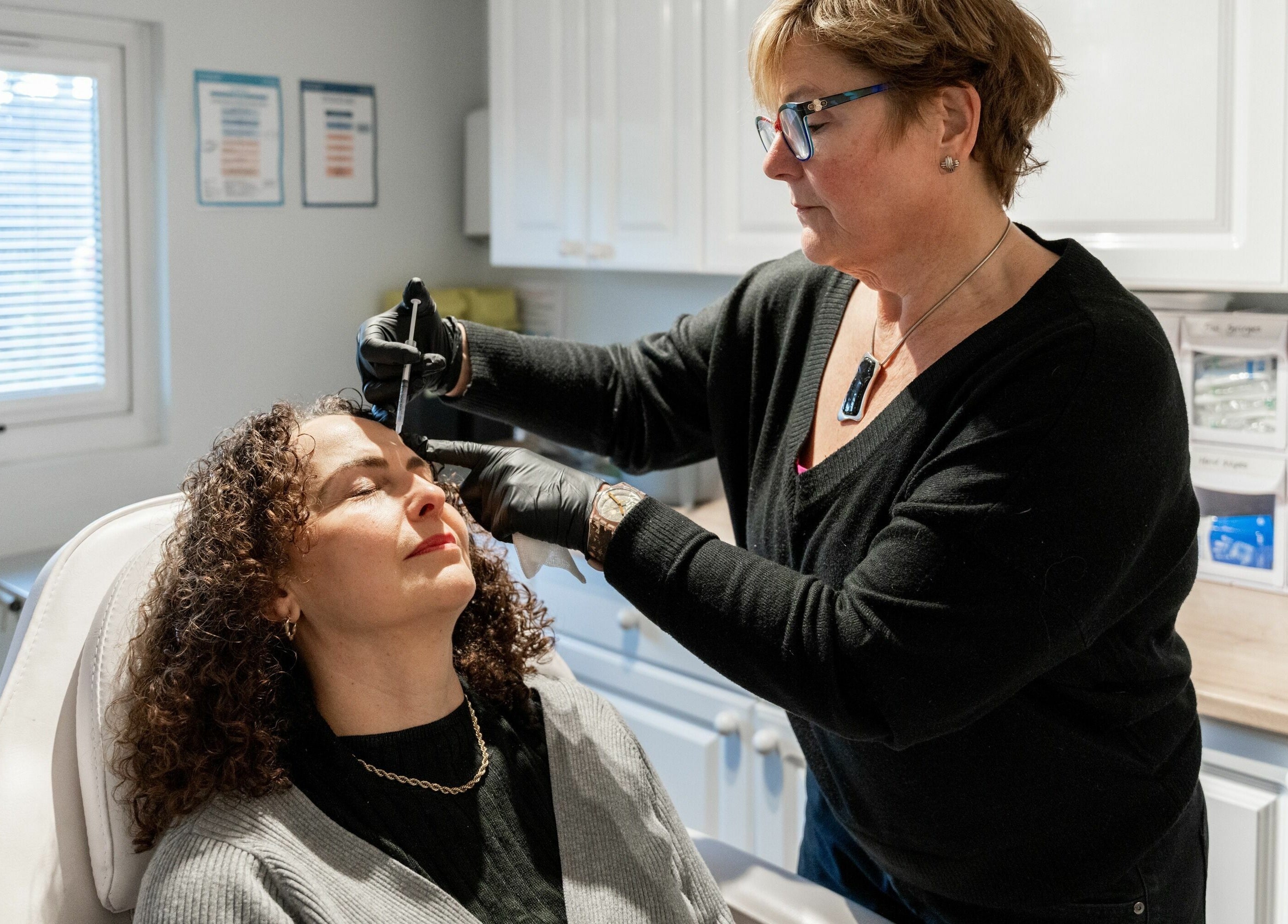 Professional skincare treatment at Tocolo Ltd, Abbots Langley, England, GB. Expert uses a precision tool.