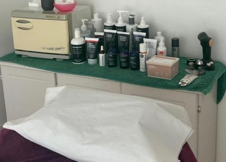 Beauty products and equipment at Adele Intuitive Skin, Luton, England, GB await clients on a treatment table.