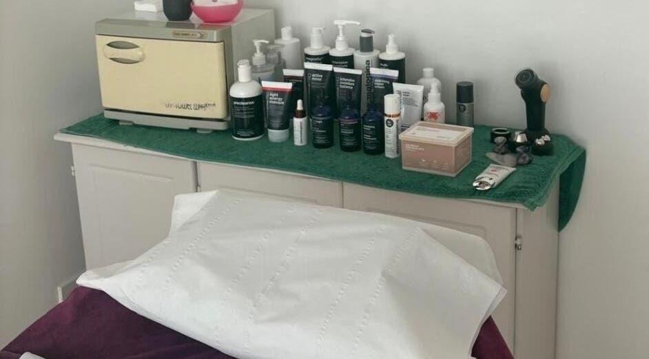 Beauty products and equipment at Adele Intuitive Skin, Luton, England, GB await clients on a treatment table.