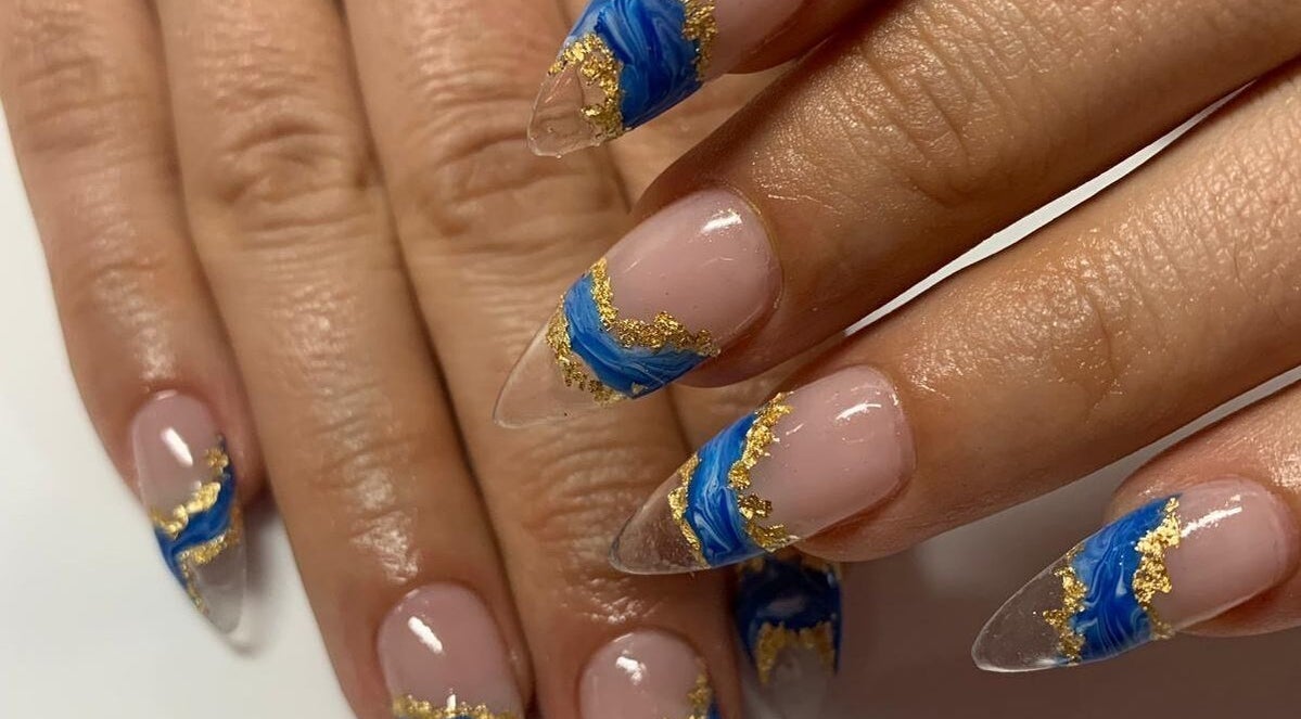 Stunning blue and gold nail art at MatNails Beauty The St. Botolph Building, London, England, GB.