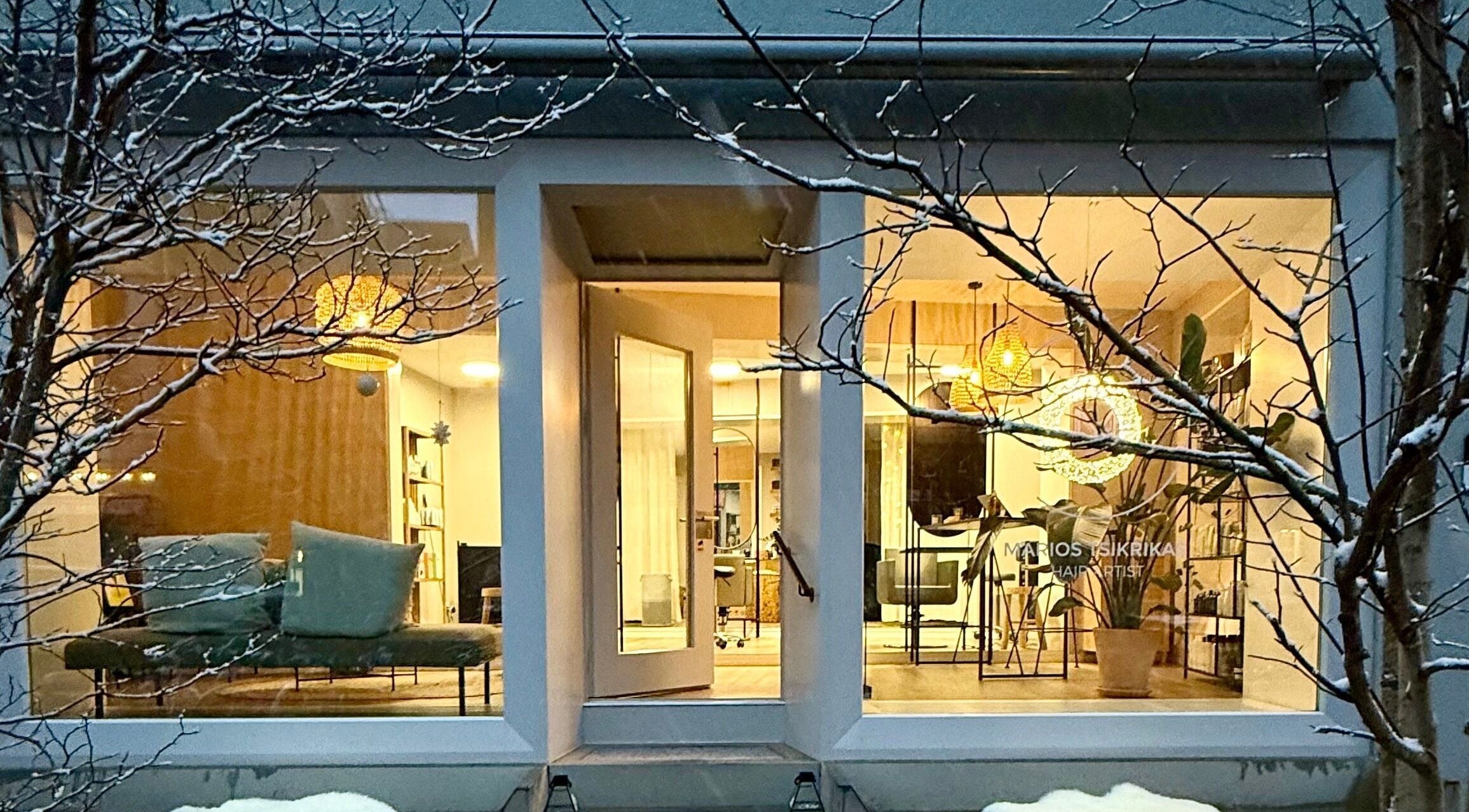 Front view of Marios Tsikrikas Hair Artist salon warmly lit, located in Zürich, Zürich, CH.