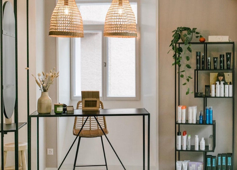 Stylish studio interior at Marios Tsikrikas Hair Artist in Zürich, Zürich, CH with products and chic decor.