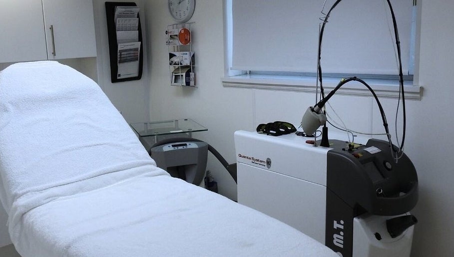 Modern treatment room at Strathearn Clinics in Glasgow, Scotland, GB features advanced laser equipment and a relaxing ambiance.