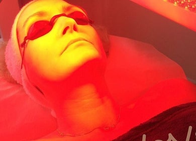 Woman undergoing LED light therapy at Strathearn Clinics, Glasgow, Scotland, GB for rejuvenating skincare.