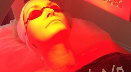 Woman undergoing LED light therapy at Strathearn Clinics, Glasgow, Scotland, GB for rejuvenating skincare.