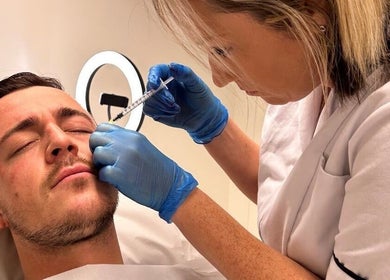 Facial treatment at Strathearn Clinics, Glasgow, Scotland, GB. Aesthetic practitioner applying dermal filler.