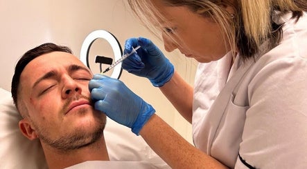 Facial treatment at Strathearn Clinics, Glasgow, Scotland, GB. Aesthetic practitioner applying dermal filler.