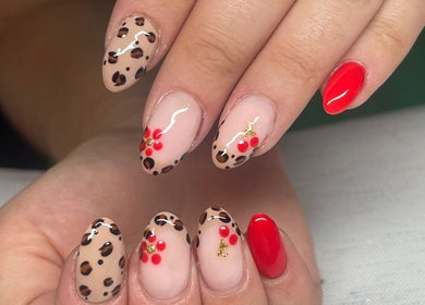 Stylish nail art with leopard and floral designs at Swift Hair & Beauty By Natalya, Bangor, Northern Ireland, GB.
