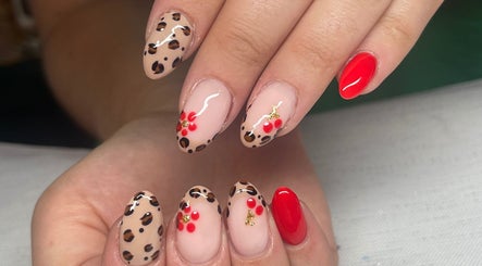 Stylish nail art with leopard and floral designs at Swift Hair & Beauty By Natalya, Bangor, Northern Ireland, GB.